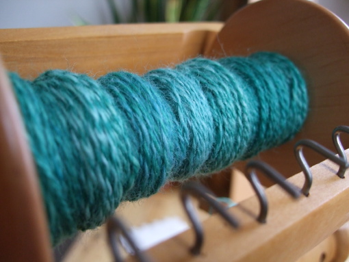 Handdyed Carded Merino on spinning wheel